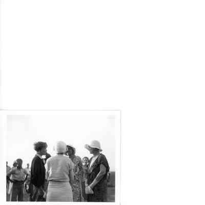 Amelia Earhart visiting with women, Tulsa Airport
