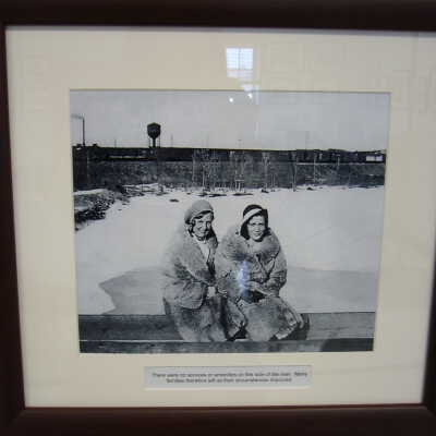 Photograph - Two unidentified women seated on the west bank of the Vermillion River, Capreol