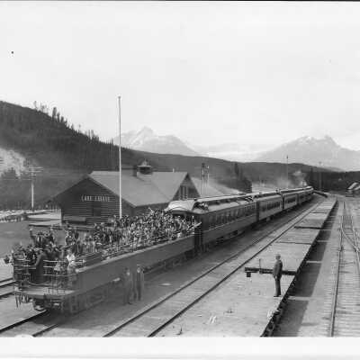 Canadian Pacific Westbound Transcontinental Train at Lake Louise, Alberta with Observation Cars filled with Girl Guides