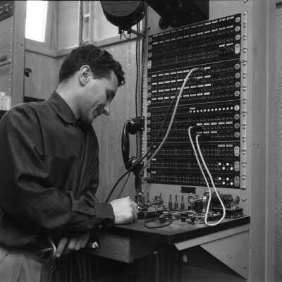 Photograph, Man working at the Canadian National telegraph and cable office, Kitimat, British Columbia .