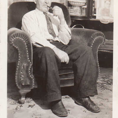Photograph- Mr. Gilbert Smoking a Pipe