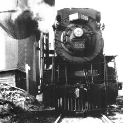 Photograph - Canadian National Railways locomotive no. 3396 beside water tank