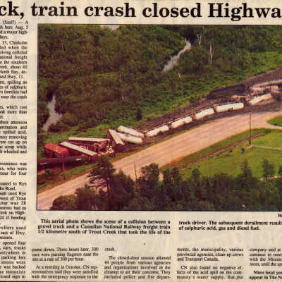 Newspaper article - Truck, train crash closed Highway 11