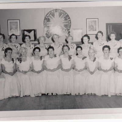 Photograph, CNR Lady Trainmen Drill Team Lodge, Capreol, Ontario, 1955 Bottom Row, L-R: Camila Bertrand, Julie Godin, Cora Edwards, Myrtle Ledingham, Chris O'Connor, Mabel Tetreau, Enid Mohns, Kay Potter, Margaret Watt, Bea Ayrest, Bea Metcalf. Top Row L-R: Jean Clark, Florence Smart, Ethel Kelly, Peg Stewart, Marie Briscoe, Peg Pickett, Violet Hayes, Maise Fitzgerald, Billie Thomson, Ollie Thomson, Bea Fawcett, Martha Bell