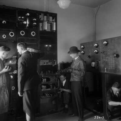 Photograph, Canadian National Railways (CNR) telegraph engineers testing the worlds first two way telephone system for speaking to and from moving train.
