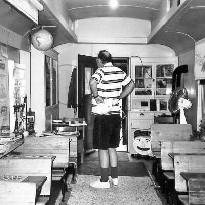 Photograph - Ken Hill inside the Sloman school car, 1994