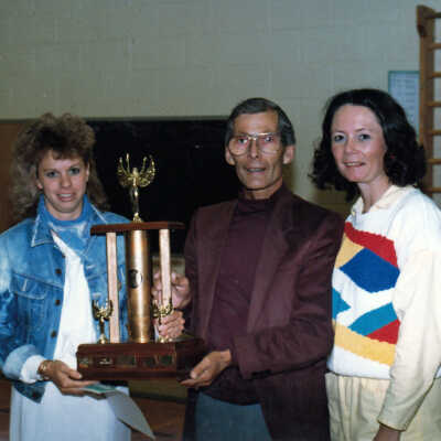Photograph, Girl in Denim Jacket Holding a Trophy