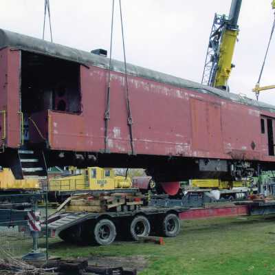 Photograph, CN Baggage Car on Crane, Being Placed at NORMHC.