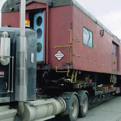 Photograph, CN Baggage Car on Flatbed.
