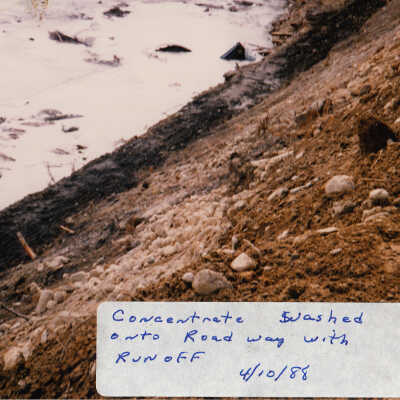 Photograph, Train Derailment, 1988, Set of 175 Pictures. "Looking down onto road way at concentrate washed onto road 4/10/88"