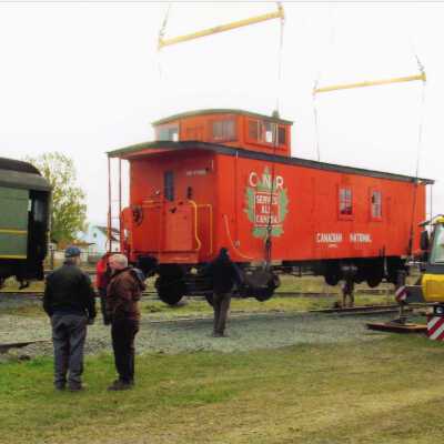 Photograph, CN Wooden Caboose Being Moved at NORMHC.