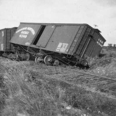 Photograph, Train accident, Derailed Canadian Northern Box Car.