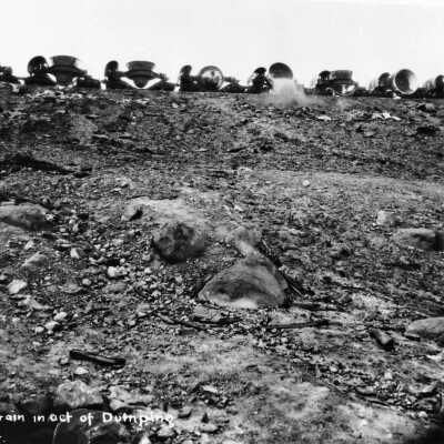 Photograph - Slag pot train in act of dumping, Copper Cliff, Ontario