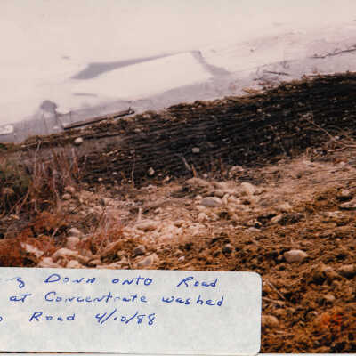 Photograph, Train Derailment, 1988, Set of 175 Pictures. "Looking down onto road way at concentrate washed onto road 4/10/88"