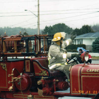 Photograph - Firefighter driving a Bickle Combination Pumper in the Capreol Santa Claus parade