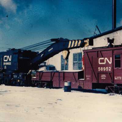 Photograph- CN Crane no. 50022 and Auxiliary Cabin Car no. 58952