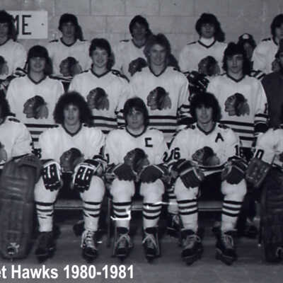 Photograph, 1980-1981 Capreol Midget Hawks. Jacque Legault, Mike Labelle, Glen Paul, Brad Barrand, Andy Boudreau, Liam Rourke, Kevin Fredette, Peter Boudreau, Mark Dzurban, Dave Irving, Harvey Dasti, Henri Boudreau, Peter-John McKinnon, Chris Thompson, Phillip Higgins, Dennis Burns, Manager R. McKinnon, Coach Andy Boudreau and Garnet Rourke, Stick Boy - Paul Boudreau.