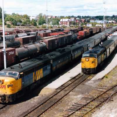 Photograph - VIA Rail trains in a railroad yard