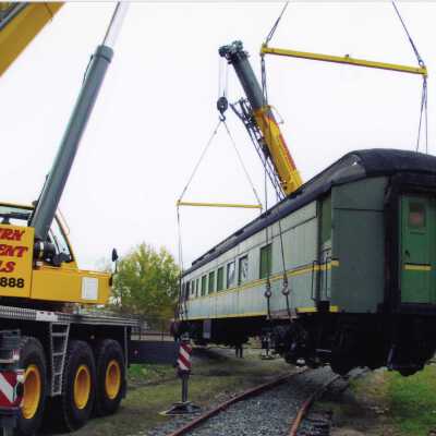 Photograph, School Car Being Moved by Crane.