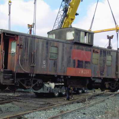 Steel Caboose Being Installed in Prescott Park