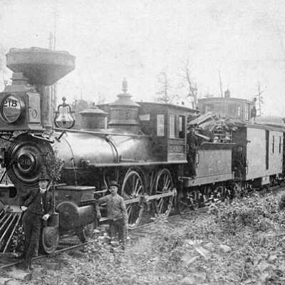 Photograph, C.P.R. (Canadian Pacific Railway) "Algoma Mixed" service, drawn by Locomotive No.218, with Conductor C.T. Boyce at left.
