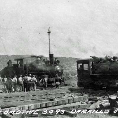 Photograph - Two BANC switch engines attempting to right derailed locomotive #3493, group of men look on