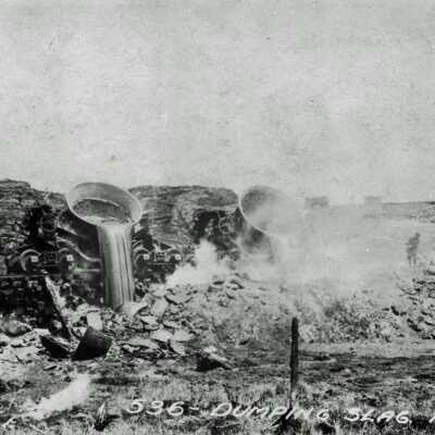 Photograph - Slag pot train dumping slag, 1920