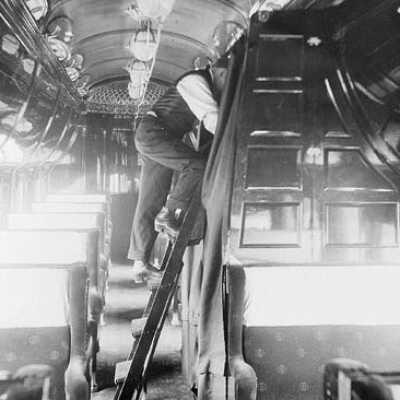Photograph, Preparing berths on a Canadian Northern Railway sleeping car, 1915.
