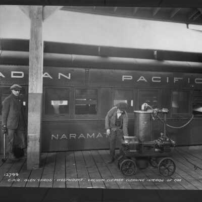 Photograph, Canadian Pacific Railway Glen Yards, Westmount, Vacuum cleaning interior of car.