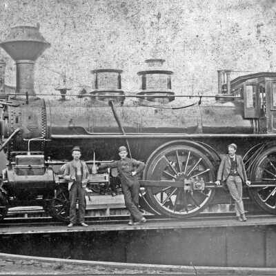 Photograph, Five men standing next to train engine 691, 2.