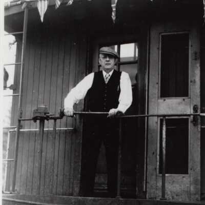 Photograph- Addie Sweezey on Back of Caboose