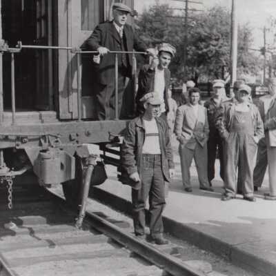 Photograph- Addie Sweezey on Back of Caboose With his Sons