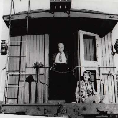 Photograph- Addie Sweezey on Back of Caboose
