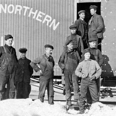 Photograph, Men standing in front of Canadian Northern Caboose.