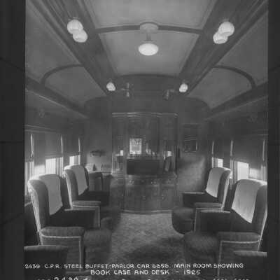 Photograph, Canadian Pacific Railway steel buffet car 6656. Main room showing book, case and desk. 1925.