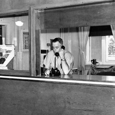 Photograph - Alf Morris on the telephone, Capreol Y.M.C.A.