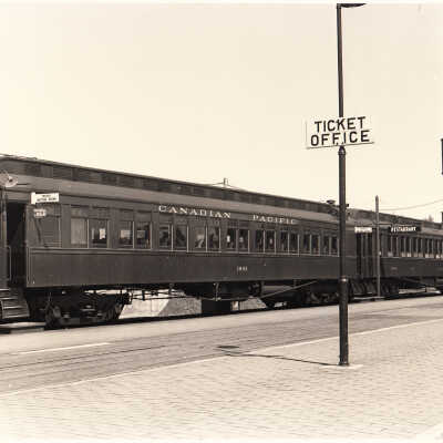Photograph: "CPR Coach no. 1803-6400. Ticket office sign in front." Sudbury, ON late 1940s replacement of station facilities during building renovations