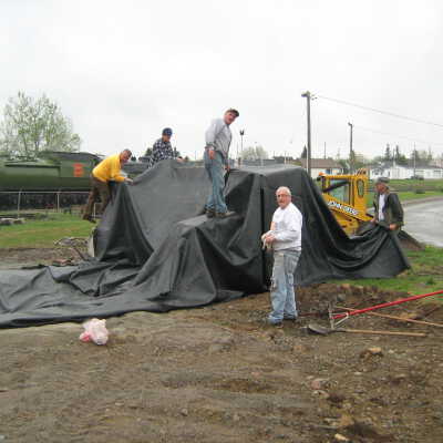 Photograph, NORMHC, Laying Tarp for Garden of Life Pond, 2011.
