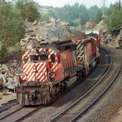 Photograph, Canadian Pacific Engine 5573 followed by 2 locomotives