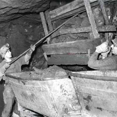 Photograph, Loading Ore Into a Rail Car from the Chute.