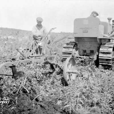 Photograph, Nakina, Ontario, plow and tractor at work, July 1935.