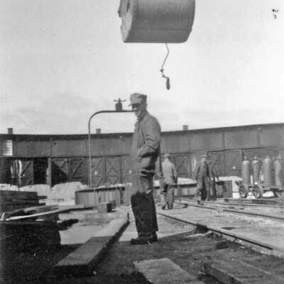 Photograph, Man Posing in Capreol Roundhouse During Construction.