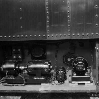 Photograph, Close up showing the motor generator equipment mounted underneath the Canadian National Railways Car "Minaki".