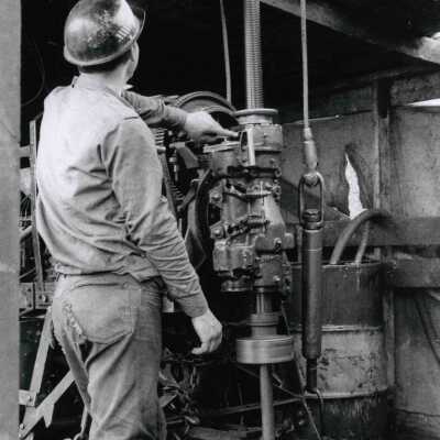 Photograph, Mine Employee Operating Machinery.
