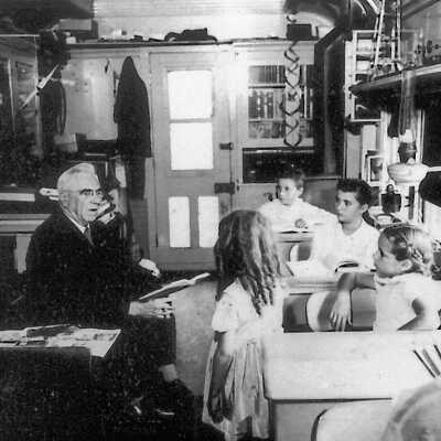 Photograph - Fred Sloman teaching literature on the school car