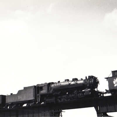 Photograph: "CNR Engine no. 4030 and Van CNR on bridge."