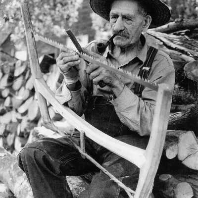 Photograph, John Hack, Man with Hacksaw.