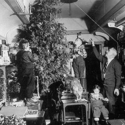 Photograph - Fred Sloman and students decorating a Christmas tree on the school car