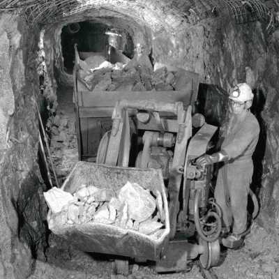 Photograph, Mucking Machine Scooping Ore.