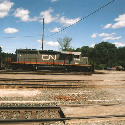 Photograph - CN locomotive no. 6910 in railroad yard